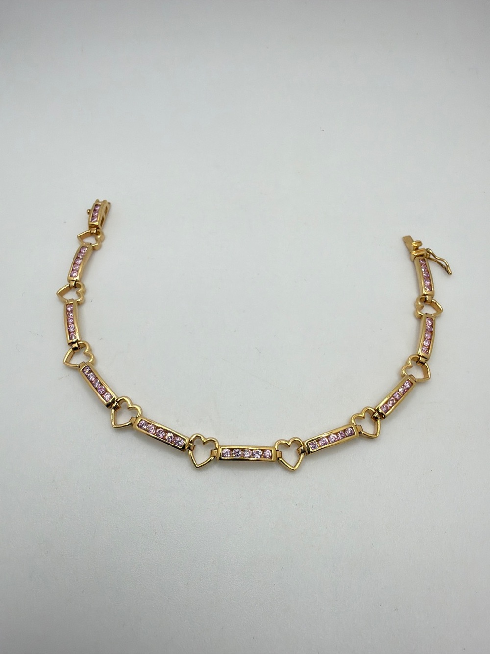 7.5" Channel set pink cz's and hearts tennis‎ bracelet in gold over 925!